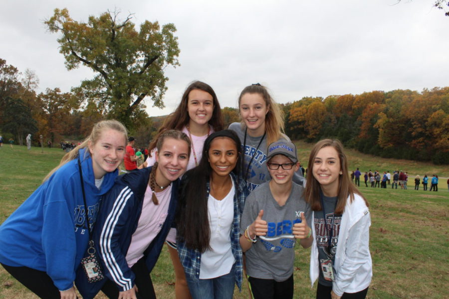 Members of the cross country team gather for a photo at a late season meet. Photo by Alyssa Griffith.